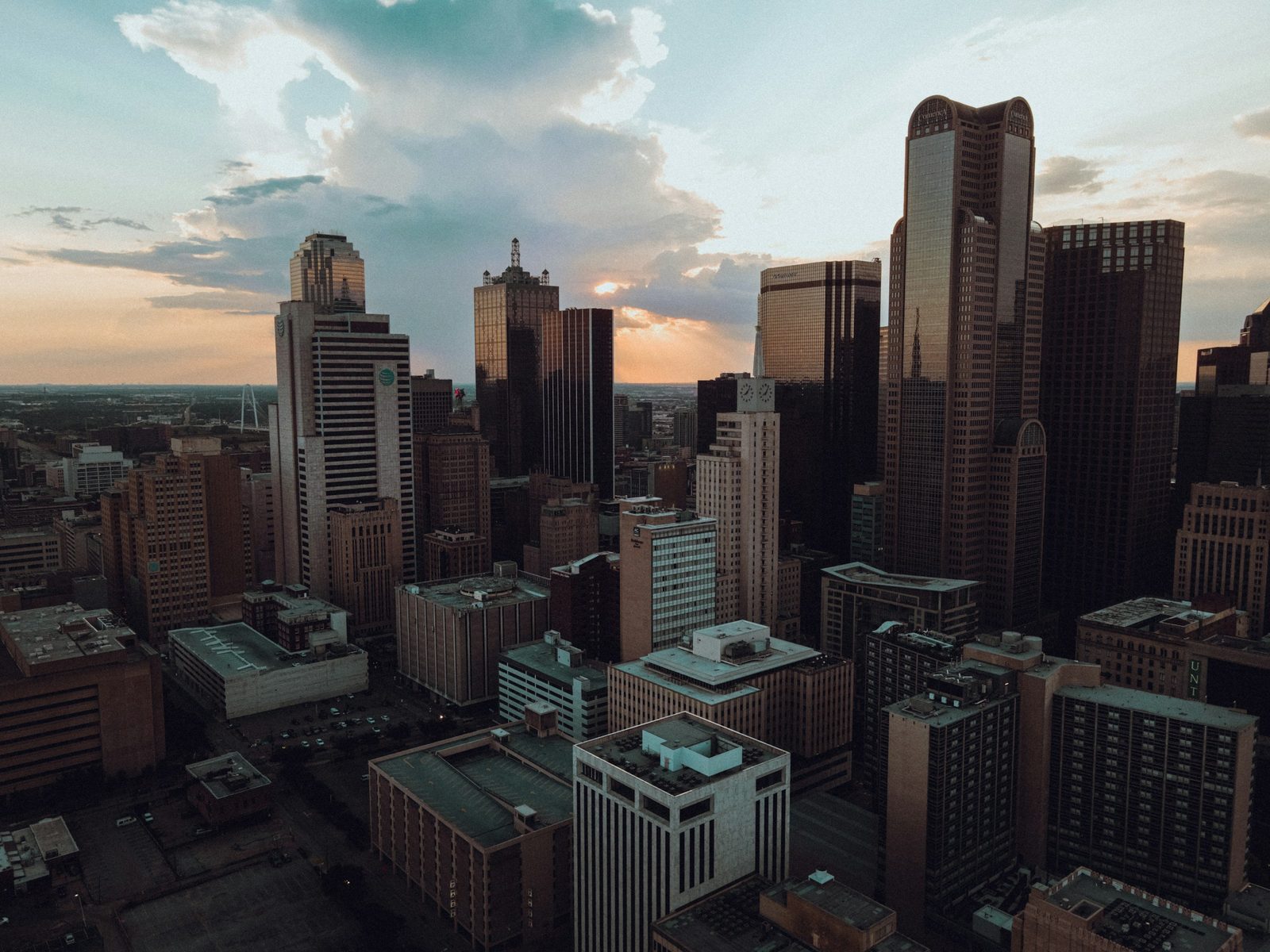 Downtown Dallas at sunset, its towers backlit